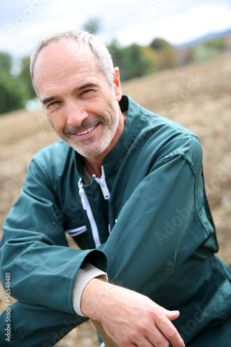 Photo: Portrait of cheerful farmer in agricultural field Portrait of cheerful farmer in agricultural field