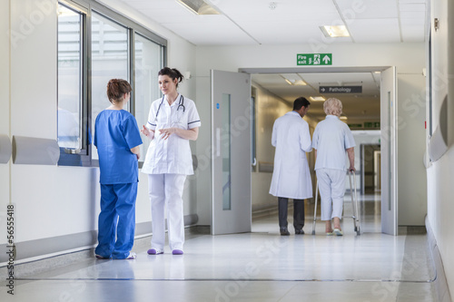 Photo: Doctors Nurses Hospital Corridor & Senior Female Patient Doctors Nurses Hospital Corridor & Senior Female Patient
