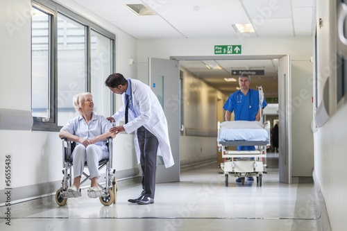 Photo: Doctor Patient Hospital Corridor Nurse Pushing Gurney Stretcher Doctor Patient Hospital Corridor Nurse Pushing Gurney Stretcher
