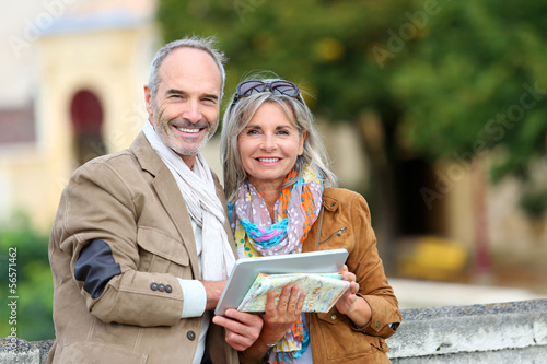 Photo: Senior couple of tourists on a trip Senior couple of tourists on a trip