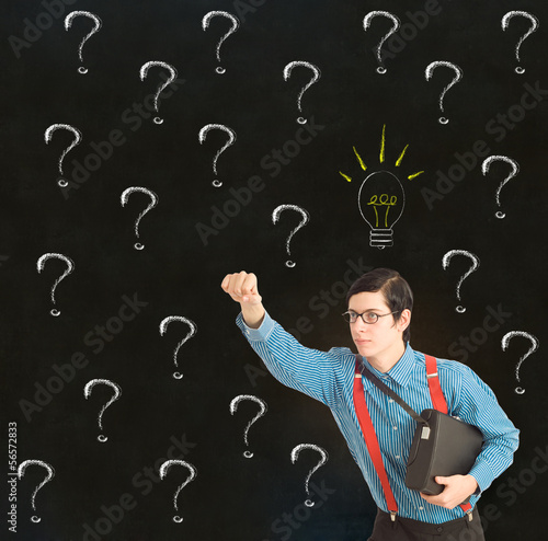 Photo: Nerd businessman with chalk question marks ideas Nerd businessman with chalk question marks ideas