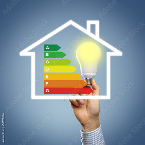 Photo: Energieeffizienz mit Hand und Lampe Energieeffizienz mit Hand und Lampe