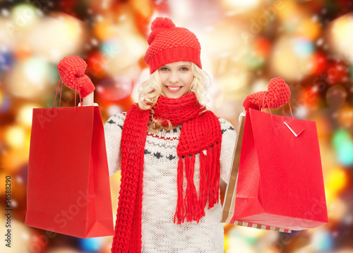 Photo: teenage girl in winter clothes with shopping bags teenage girl in winter clothes with shopping bags