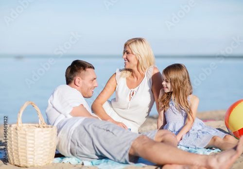 Photo: happy family having a picnic happy family having a picnic