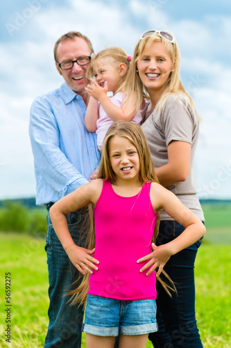 Photo: Happy Family in the meadow Happy Family in the meadow