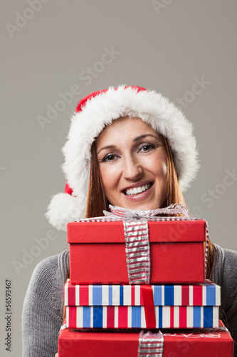 Photo: Beautiful woman holding Christmas presents Beautiful woman holding Christmas presents