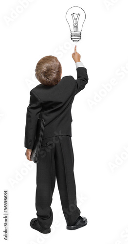 Photo: Child in a tuxedo pointing at wall. Rear view. Isolated over wh Child in a tuxedo pointing at wall. Rear view. Isolated over wh