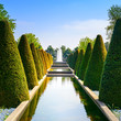 Garden in Keukenhof, conical hedges and fountain. Netherlands Garden in Keukenhof, conical hedges and fountain. Netherlands