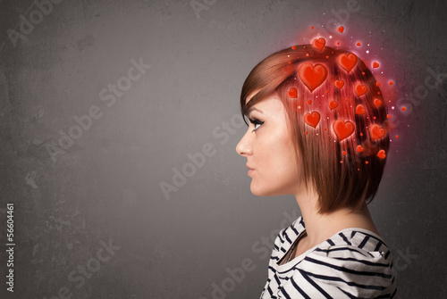 Photo: Young person thinking about love with red hearts Young person thinking about love with red hearts