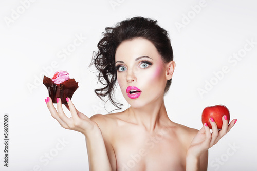 Photo: Dieting. Unsure Bewildered Girl Choosing Apple or Cake Dieting. Unsure Bewildered Girl Choosing Apple or Cake