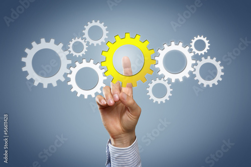 Photo: Hand with cogwheels Hand with cogwheels