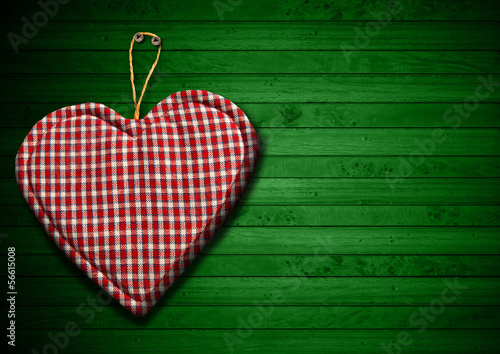 Illustration: Cloth Heart on Green Wood Background Cloth Heart on Green Wood Background