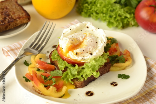 Photo: Poached egg on toast with vegetables Poached egg on toast with vegetables