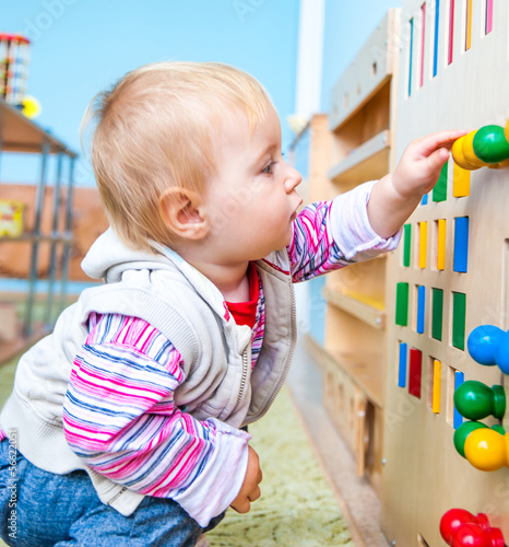 Photo: little girl in the classroom early development little girl in the classroom early development