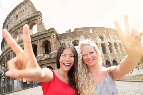 Photo: Travel tourist girl friends by Colosseum, Rome Travel tourist girl friends by Colosseum, Rome