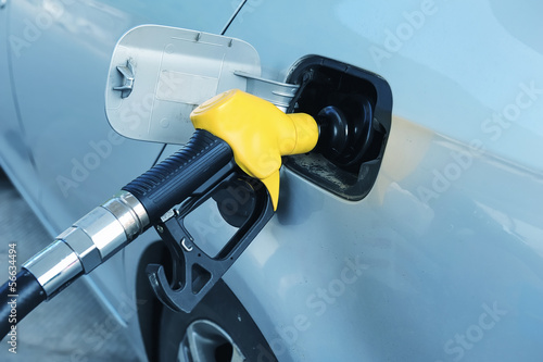 Photo: fill up fuel at gas station fill up fuel at gas station