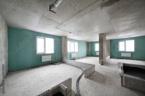 Photo: New apartment in building under construction without finishing New apartment in building under construction without finishing