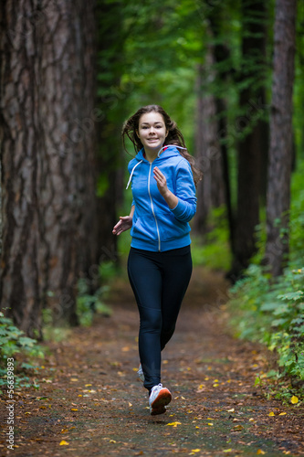 Photo: Girl running in park Girl running in park