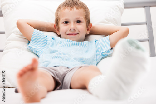 Photo: Little child boy with plaster bandage on leg heel fracture or br Little child boy with plaster bandage on leg heel fracture or br