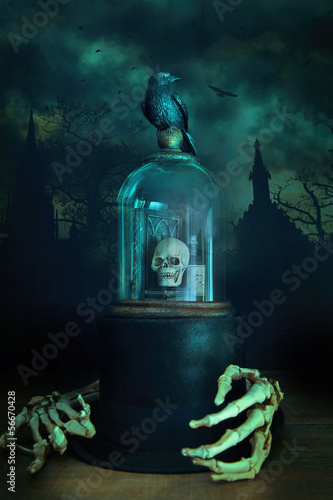 Photo: Glass bell jar with crow and skeleton hands Glass bell jar with crow and skeleton hands