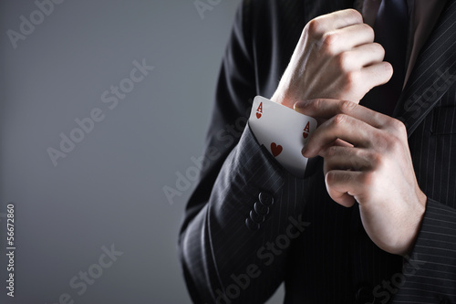 Photo: Businessman with ace card Businessman with ace card