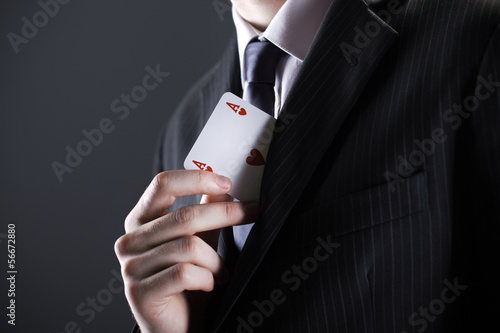 Photo: Businessman with ace card Businessman with ace card