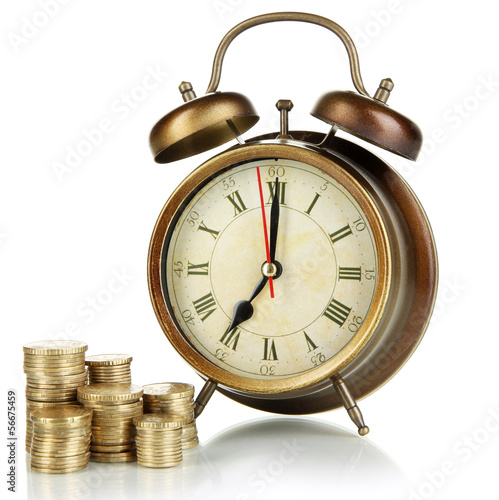 Photo: Antique clock and coins isolated on white Antique clock and coins isolated on white