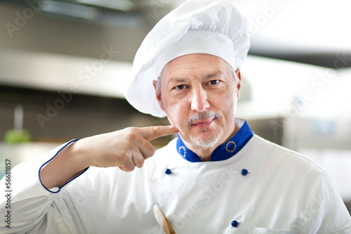 Photo: Happy chef satisfied for his good work Happy chef satisfied for his good work