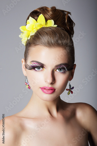 Photo: Showy Woman with Vivid Colorful Makeup and False Long Eyelashes Showy Woman with Vivid Colorful Makeup and False Long Eyelashes