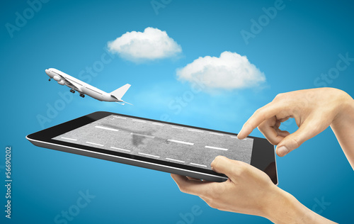 Photo: tablet with fly airplane tablet with fly airplane