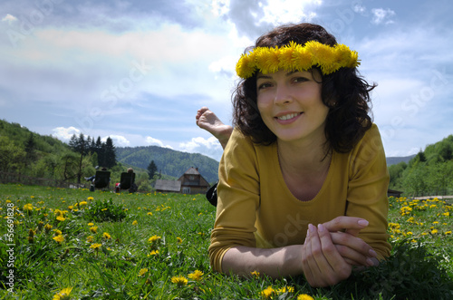 Photo: Close up of a young woman lying in a meadow Close up of a young woman lying in a meadow