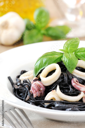 Photo: Fresh black squid ink pasta with seafood and basil Fresh black squid ink pasta with seafood and basil