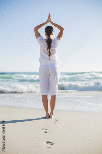 Photo: Rear view of gorgeous woman in yoga pose Rear view of gorgeous woman in yoga pose