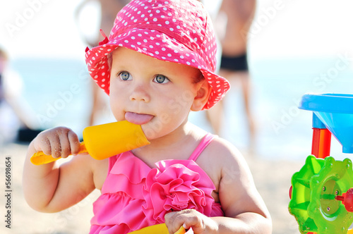 Photo: baby playing toys on beach baby playing toys on beach