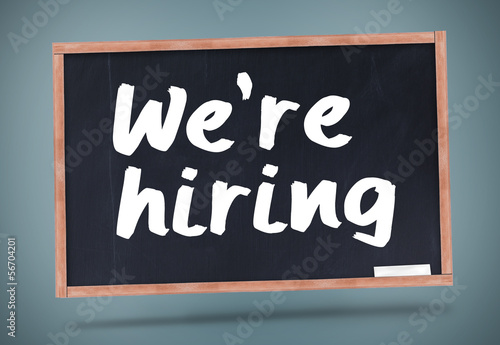 Photo: We are hiring written on chalkboard We are hiring written on chalkboard