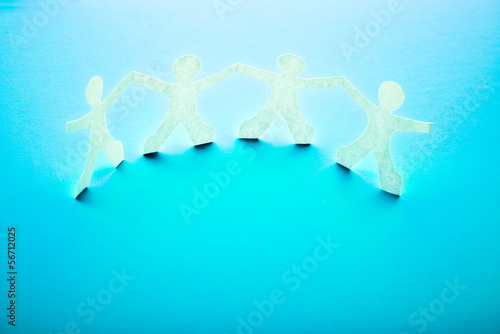Photo: Paper people in teamworking concept Paper people in teamworking concept