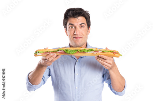 Photo: Young Man Holding Baguette Sandwich Young Man Holding Baguette Sandwich