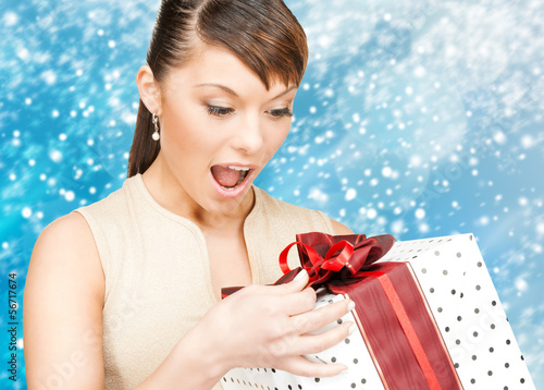Photo: happy woman with gift box happy woman with gift box