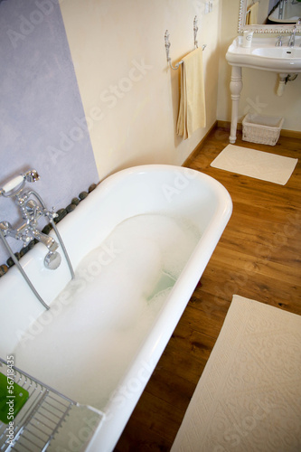 Photo: Closeup of old-fashioned bathtub Closeup of old-fashioned bathtub