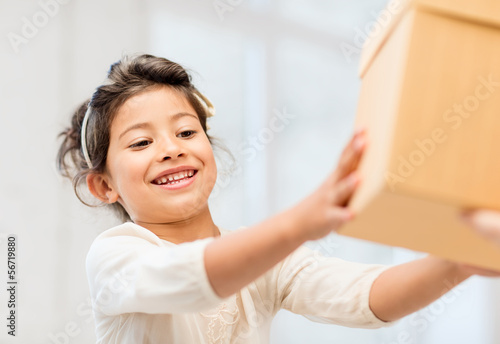 Photo: happy child girl with gift box happy child girl with gift box