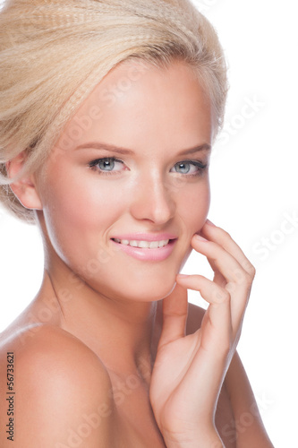 Photo: Woman toucing her face Woman toucing her face