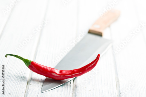 Photo: chili pepper on knife chili pepper on knife