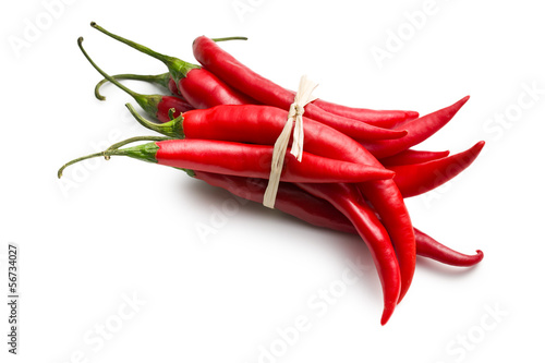 Photo: tied chili peppers on white background tied chili peppers on white background
