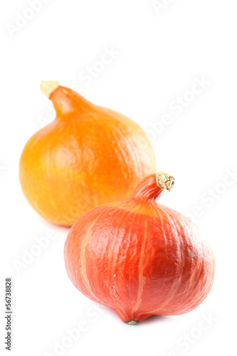 Photo: Ripe Hokkaido pumpkins isolated on white background Ripe Hokkaido pumpkins isolated on white background