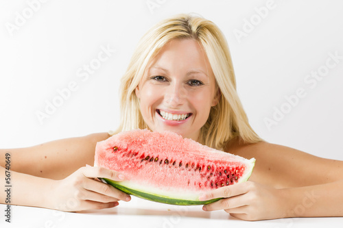 Photo: Happy young woman eating fresh watermelon Happy young woman eating fresh watermelon