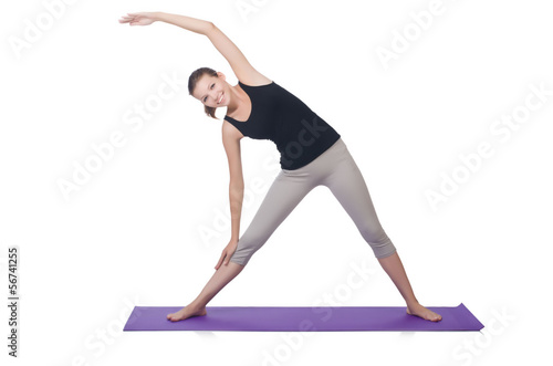 Photo: Young female doing exercises on white Young female doing exercises on white