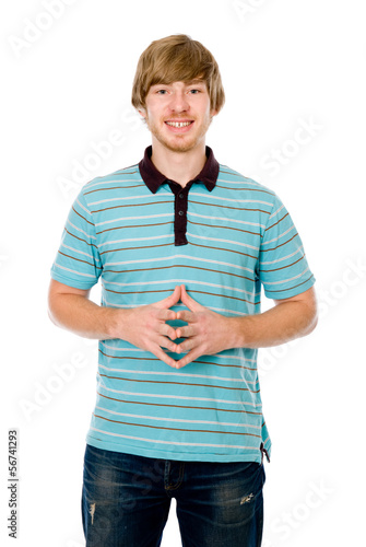 Photo: The young man smiles and looks into the camera. The young man smiles and looks into the camera.