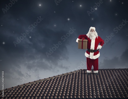 Photo: Santa Claus on a roof Santa Claus on a roof