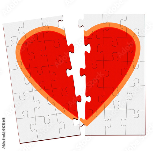 Photo: Broken heart jigsaw over white Broken heart jigsaw over white
