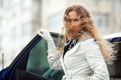 Photo: Sad beautiful woman at the car Sad beautiful woman at the car